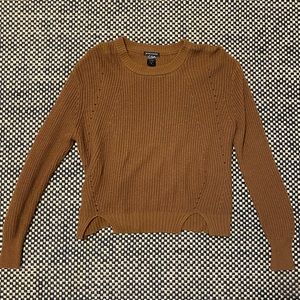 Brown knit sweater with zip up back.
